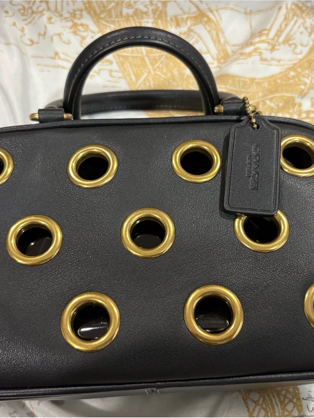 Coach Black Leather Satchel with Gold Grommet Accents